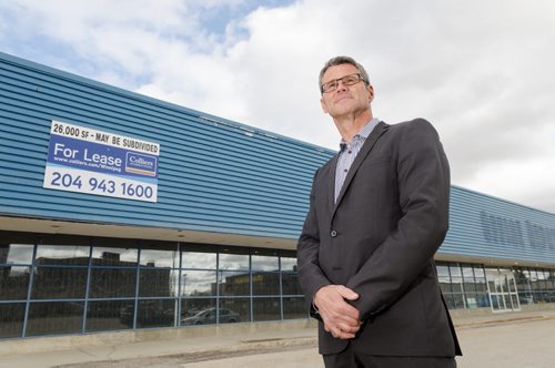 John Prall of Colliers International stands in front of a building that is due to be leased.  The building has sat empty for nearly three years, since the Office Depot closed.  EMILY CUMMING / WINNIPEG FREE PRESS