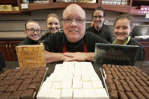 May 3, 2014 - 140503  - Fred Morden, owner of Mordens' of Winnipeg, a chocolatier who is celebrating the company's 55 anniversary is photographed with some of his staff (L to R) Alanna, Mariel, Tiffaney, and Hannah in his Sargent Avenue store Saturday, May 3, 2014. John Woods / Winnipeg Free Press