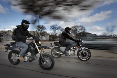 May 3, 2014 - 140503  - James Lowen (L) and Steve Orvis ride their motorcycles down Main Street in Winnipeg Saturday, May 3, 2014. There was a motorcycle safety rally at the legislature today. John Woods / Winnipeg Free Press