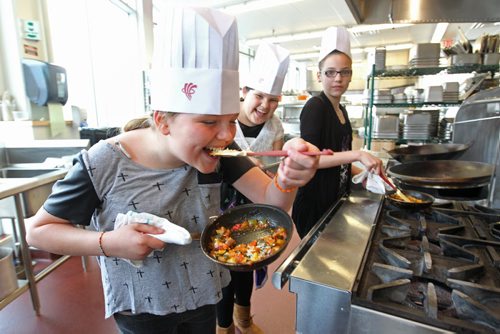 Grade 6 students from Strathcona School taste test a vegetable stir fry  at Red Rivers food institute  during the Junior Master Chef Culinary Adventure Saturday. The students were the Grand Prize winners in a Recipe for Success Video Cooking Contest after their sandwich making video - The Wrap of Awesomeness, was chosen by public voting and judges to be the best video on how to create a nutritious and delicious sandwich.   Names from left Miranda Quill, Kysha Desmarais Mekish and Shay Harris.  May 03, 2014 Ruth Bonneville / Winnipeg Free Pres