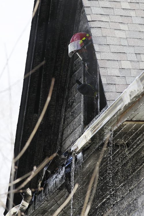 May 3, 2014 - 140503  - A firefighter gives the thumbs up to a crew member during a fire at 203 and 205 Spence Sunday, May 4, 2014.  John Woods / Winnipeg Free Press