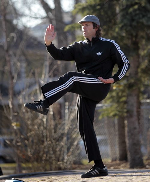 David Lane moves through his Kung Fu and Tai Chi exercises in the sunshine in Vimy Ridge Park Monday morning. Wayne Glowacki / Winnipeg Free Press May 5 2014
