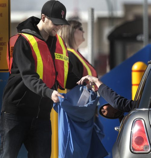 It's in the bag. Drive thuru service was steady at the Winnipeg Tax Centre on Stapon Road Monday morning as the deadline for individual tax returns for 2013 is May 5.  Wayne Glowacki / Winnipeg Free Press May 5 2014