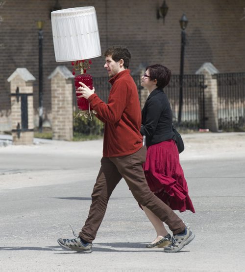 140505 Winnipeg - DAVID LIPNOWSKI / WINNIPEG FREE PRESS (May 05, 2014)  A man walks with a lamp down Osborne Street Monday afternoon.