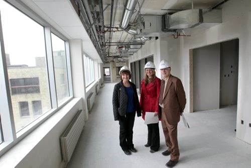 Finance. From right, leasing agent  Joe Diner and Vici Marentette, Sales Associate,both with CBRE Ltd. Winnipeg,  with Barbara Lapointe, property manager for United Equities Group/MPN Holdings Ltd. on one of the floors being renovated in 111 Lombard Ave. (former Bricks Fine Furniture bldg.).  Theyre more than half way through the $25-million conversion of this  century-old heritage building into a Leed-Silver office complex.   Murray McNeill story   Wayne Glowacki / Winnipeg Free Press May 6 2014