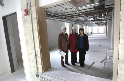 Finance. From left, leasing agent Joe Diner and Vici Marentette, Sales Associate, both with CBRE Ltd. Winnipeg,  with Barbara Lapointe, property manager for United Equities Group/MPN Holdings Ltd. on one of the floors being renovated in 111 Lombard Ave. (former Bricks Fine Furniture bldg.).  Theyre more than half way through the $25-million conversion of this  century-old heritage building into a Leed-Silver office complex.   Murray McNeill story   Wayne Glowacki / Winnipeg Free Press May 6 2014