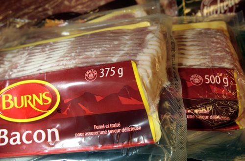 Two packages of bacon in Cantors Grocery Co. fridge. In front is a package from the latest shipment weighing in at 375g beside a package in his cooler at a weight of a 500g. Murray McNeill story   Wayne Glowacki / Winnipeg Free Press May 6 2014