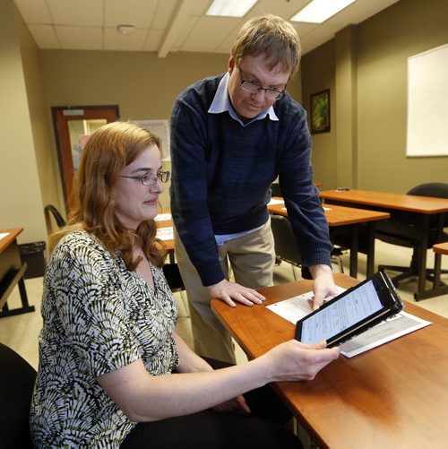 LOCAL - welfare moms , photo of Lydia Kettler, who is taking a course at CDI College , also in pic is accounting and payroll instructor Ryan Ronald at CDI . It is for the feature Larry is doing on single welfare moms getting into the workforce  Running Saturday. Story  by Larry Kusch May 5 2014 / KEN GIGLIOTTI / WINNIPEG FREE PRESS