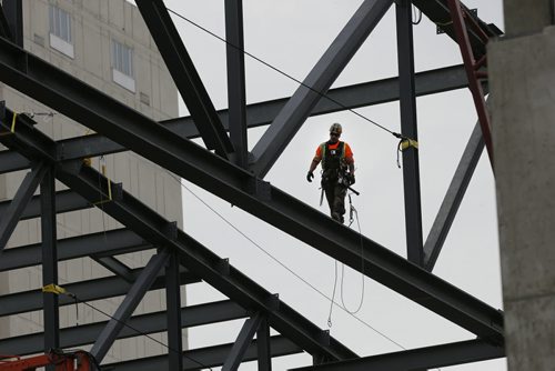 STDUP . RBC Winnipeg Convention Centre  's $180 million renovation and expansion continues  with Iron Workers  erecting steel 60 ft. aboove the ground  for the expansion . May 7 2014 / KEN GIGLIOTTI / WINNIPEG FREE PRESS