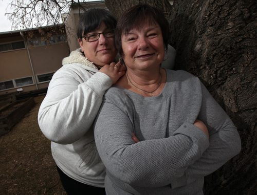 Micheline Fay and her mother Doris pose in front of their Windsor Park side by side. See mothers day feature written by Micheline. May 7, 2014 - (Phil Hossack / Winnipeg Free Press)
