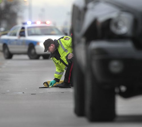 Winnipeg Police on Dufferin Ave. between Parr St. and McKenzie St. Thursday morning where it is reported a person was struck by a pickup truck. Wayne Glowacki / Winnipeg Free Press May 8 2014