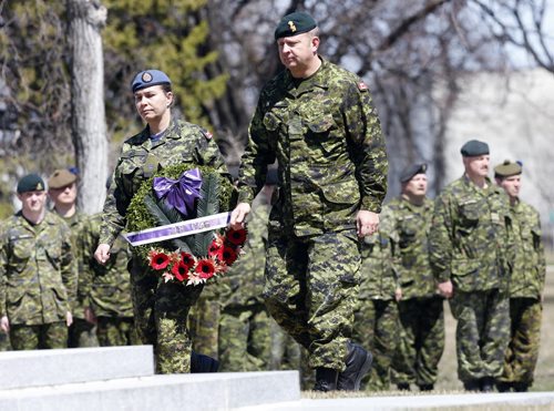 LtoR Warrent Officer Kelly Verge  and Col. Ross Ermel lay wreath  at Brookside  Cemetery cerimony -LOCAL - National Day of Honour  Winnipeg,  part of CanadaÄôs National Day of Honour vigil. Announced last March, the Prime Minister of Canada, the Right Honourable Stephen Harper announced  that May 9th, 2014, has been designated by Royal Proclamation as a National Day of Honour. This one-time ceremony, conducted by the Army Reservists from 38 Canadian Brigade Group and supported by local VIPs, will mark the end of CanadaÄôs contribution to the Afghanistan War, one where 158 Canadian soldiers, sailors and airmen lost their lives in battle.National Day of Honour Vigil held at Brookside Cemetery ÄòField of HonourÄô.There will be a coordinated two minutes of silence across the country (12:30 pm- Winnipeg-time) to remember the fallen comrades during the Canadian 12-year commitment to peace and security in Afghanistan. The ceremony has significant meaning to the army community surrounding the Winnipeg area. Soldiers, past and present, will also pay tribute to the more than 40,000 Canadian Armed Forces (CAF) men and women who served as well as others who contributed. May 9 2014 / KEN GIGLIOTTI / WINNIPEG FREE PRESS