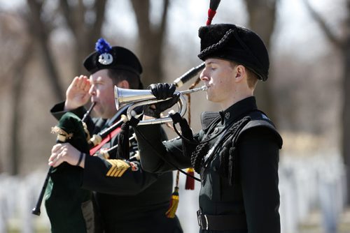 Bugler  Cpl. Joel Lessard  plays reveille  as piper WO John Dawson  salutes  during Brookside Cemetery cerimony- LOCAL - National Day of Honour  Winnipeg,  part of CanadaÄôs National Day of Honour vigil. Announced last March, the Prime Minister of Canada, the Right Honourable Stephen Harper announced  that May 9th, 2014, has been designated by Royal Proclamation as a National Day of Honour. This one-time ceremony, conducted by the Army Reservists from 38 Canadian Brigade Group and supported by local VIPs, will mark the end of CanadaÄôs contribution to the Afghanistan War, one where 158 Canadian soldiers, sailors and airmen lost their lives in battle.National Day of Honour Vigil held at Brookside Cemetery ÄòField of HonourÄô.There will be a coordinated two minutes of silence across the country (12:30 pm- Winnipeg-time) to remember the fallen comrades during the Canadian 12-year commitment to peace and security in Afghanistan. The ceremony has significant meaning to the army community surrounding the Winnipeg area. Soldiers, past and present, will also pay tribute to the more than 40,000 Canadian Armed Forces (CAF) men and women who served as well as others who contributed. May 9 2014 / KEN GIGLIOTTI / WINNIPEG FREE PRESS