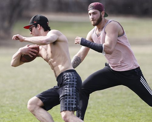May 10, 2014 - 140510  -  Matt Blumberg chases down Nicholas Cobb while playing football at Assiniboine Park Saturday, May 10, 2014.  John Woods / Winnipeg Free Press