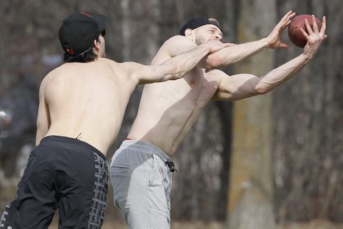 May 10, 2014 - 140510  -  Jon Blumberg reaches out for the pass as Nicholas Cobb attempts the tackle while playing football at Assiniboine Park Saturday, May 10, 2014.  John Woods / Winnipeg Free Press