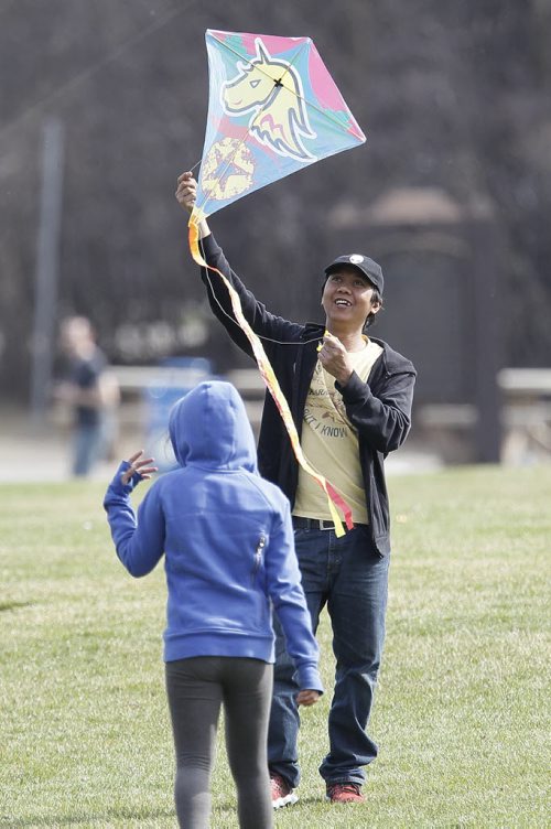 May 10, 2014 - 140510  -  Almer Navea flies a kite with his family at Assiniboine Park Saturday, May 10, 2014.  John Woods / Winnipeg Free Press