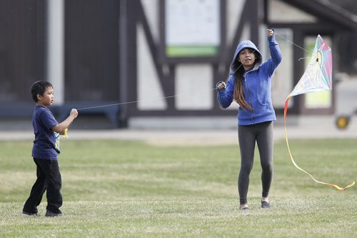May 10, 2014 - 140510  -  Almer Navea and his sister Ma.ina fly a kite at Assiniboine Park Saturday, May 10, 2014.  John Woods / Winnipeg Free Press