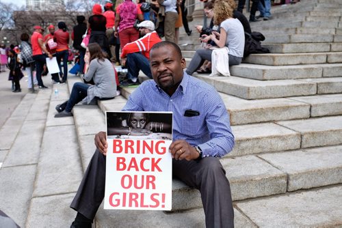 Samson Oyeyiola along with around 300 other people gathered on the steps of the Manitoba Legislature to protest and raise awareness regarding the kidnaped girls of Nigeria. "Bring back our Girls" signs, speeches and signing started around 2 P.M. 140511 May 11, 2014 Mike Deal / Winnipeg Free Press