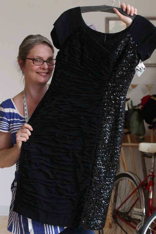 Exchange Uporium- 24 McDermot Ave- Patti Henderson runs Wildwoodrose Vintage she holds Black sequined wiggle dress circa 1950s- $95- See Connie Tamoto fashion page- May 12, 2014   (JOE BRYKSA / WINNIPEG FREE PRESS)