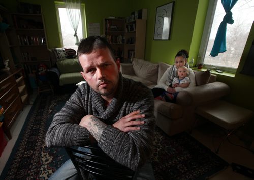 Joshua Key , poses in his St Norbert home with his wife Alexina and daughter Eva (1yr). An American soldier who sought refuge in Canada rather than support the Iraq War he is paying the price for his conscience by being denied the ability to earn a basic income or utilize taxpayer-funded health care in Canada. May 12, 2014 - (Phil Hossack / Winnipeg Free Press)