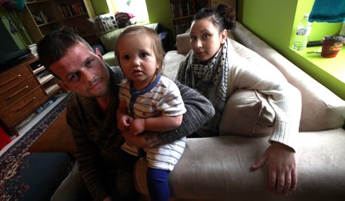 Joshua Key (left) , poses in his St Norbert home with his wife Alexina and daughter Eva (1yr). An American soldier who sought refuge in Canada rather than support the Iraq War he is paying the price for his conscience by being denied the ability to earn a basic income or utilize taxpayer-funded health care in Canada. May 12, 2014 - (Phil Hossack / Winnipeg Free Press)