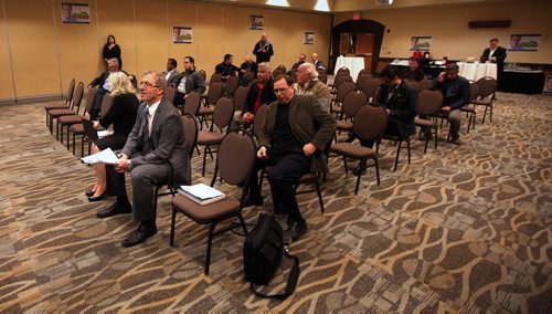 Gord Steeves sits front left waiting to chat with participants at a Monday evening meeting. See Geoff Kirbyson story. May 12, 2014 - (Phil Hossack / Winnipeg Free Press)