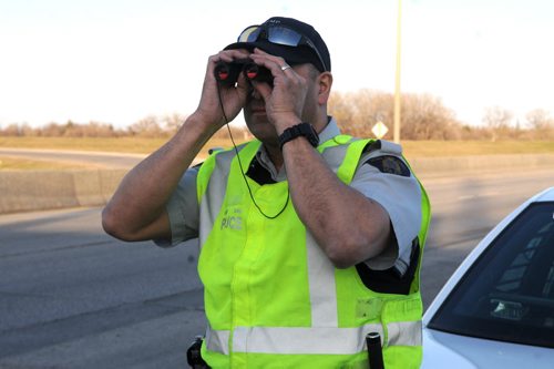 An inexpensive pair of binoculars allows RCMP Const. Darryl Berube to write costly tickets for distracted driving when he spots people on their cellphones behind the wheel.   RCMP ride-along  May 9, 2014 James Turner/Winnipeg Free Press