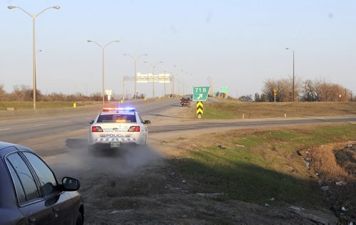 Const. Darryl Berube takes off after a motorist in a truck he spotted using his cellphone. The driver would be cited for that, as well as for several other infractions.   RCMP ride-along  May 9, 2014 James Turner/Winnipeg Free Press