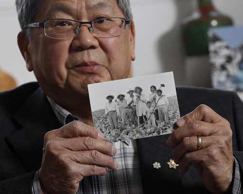 LOCAL - WWlI - Art Miki .Former Citizenship judge  Art Miki front right at age 5 with family in sugar beet field  in St. Agathe  1942 Äì Japanese internment camp survivor and president of the cultural association Äì he was a kid at the beet farm in Ste Agathe where his Japanese- Canadian family was interned in 1942 --- for 75th anniversary of WWII Carol going  .Carol Sanders | Reporter May13 2014 / KEN GIGLIOTTI / WINNIPEG FREE PRESS
