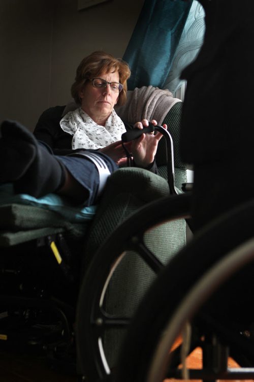 Bev Bungay reclines in her specialized chair with her cane by her side as she slowly recovers from a terrible pedestrian accident 18 months ago, where she broke 11 bones after being hit by a car crossing Portage Ave. See Mary Agnes story.  May 13, 2014 Ruth Bonneville / Winnipeg Free Pres