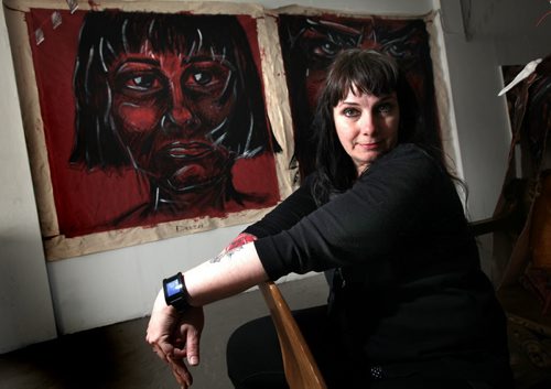 Arlea Ashcroft poses with her solo art show called Let It Burn that explores suicide and depression. See Jen Zoratti story. May 13, 2014 - (Phil Hossack / Winnipeg Free Press)