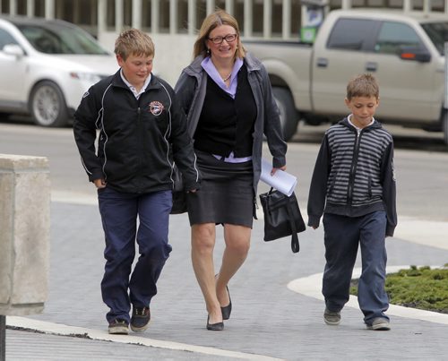 Paula Havixbeck registers to run for mayor. Her two boys (L) Nick and (R) Adrian came in with her. She was at City Hall, City Clerk's office, admin building. BORIS MINKEVICH / WINNIPEG FREE PRESS  May 14, 2014