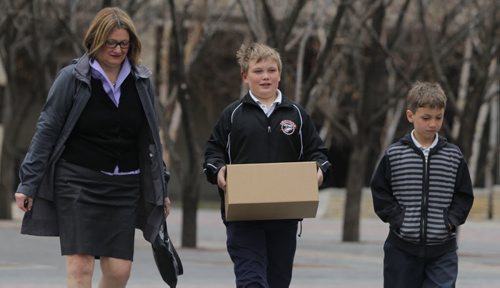 Paula Havixbeck registers to run for mayor. Her two boys Nick and Adrian came in with her. She was at City Hall, City Clerk's office, admin building. BORIS MINKEVICH / WINNIPEG FREE PRESS  May 14, 2014