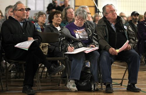 Winnipegers passed and signed a petition Wednesday evening to keep door to door postal delivery at an informational meeting held at Maples Collegiate. Geoff Kirbyson story. May 14, 2014 - (Phil Hossack / Winnipeg Free Press)