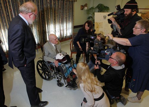 Many media outlets scrum Leo D. Flood got his high school degree from St. Paul's Highschool. Presented to him at Misericordia Place. Gerald Flood stands on the left. BORIS MINKEVICH / WINNIPEG FREE PRESS  May 15, 2014