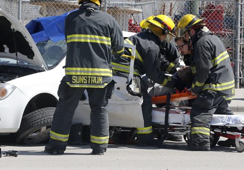 2 car MVC at on McPhillips St at Logan Ave , sent the driver of one of the cars to hospital after he was extricated from his car .  May 15 2014 / KEN GIGLIOTTI / WINNIPEG FREE PRESS