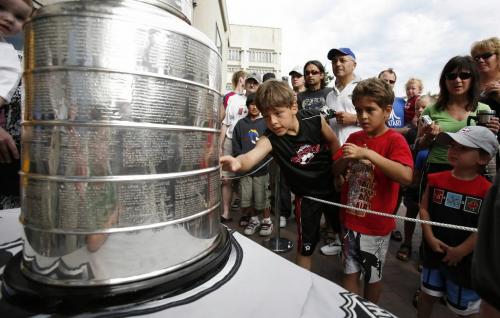 John Woods / Winnipeg Free Press / July 7/07- 070707  -  Braydon Saindon (L) and his brother Brett check out the Stanley Cup at City Hall.  Hockey hero Dustin Penner brought the Stanley Cup to City Hall Saturday July 7/07. Penner played on this year's cup-winning team, the Anaheim Ducks.