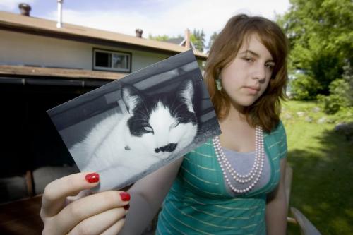 KENORA - Erin Van Breda holds up picture of her five-year-old cat Henry, who was killed by a pack of stray dogs.  Tom Thomsom for Winnipeg Free Press