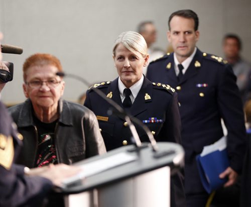 RtoL  Assistant Commissioner Kevin Brosseau , Deputy Commissioner Janice Armstrong , and Elder Marielee Nault wallking in to deliever the report . RCMP releases National Operational Review on Missing and Murdered Aboriginal Women , identifying 1,181 aboriginal  women across Canada since 1980 . May16 2014 / KEN GIGLIOTTI / WINNIPEG FREE PRESS