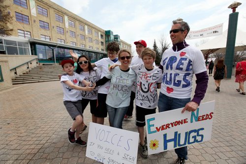 Group photo of team of huggers that took part in Voices Free Hug Day 2014, a youth initiative supported by team leader - Steve Degroot (fman on ar right, sunglasses) that was created to remember foster kids in care. See Alex Paul's story.  May 17, 2014 Ruth Bonneville / Winnipeg Free Press