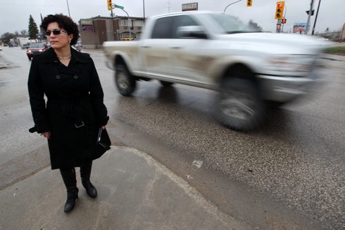 Jeannette Montufar- A traffic engineer at University of Manitoba points out problems at the intersection of Marion and Archibald - See  Mary Agnes Welch story- May 20, 2014   (JOE BRYKSA / WINNIPEG FREE PRESS)
