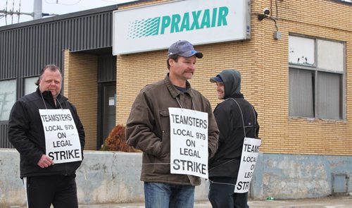 Unionized employees of Praxair, a gas compression facility at 635 McPhillips Street, have been on strike since last Thursday, May 15. They have been without a contract since July 1st of 2013, and the main dispute is over the increasing wage disparity with the same jobs at their Edmonton facility. No talks with management of the company have been set, but the union will be talking with a conciliator later today.  140521 May 21, 2014 Mike Deal / Winnipeg Free Press