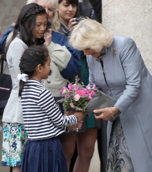 The Duchess of Cornwall  gets flowers from Meagan Gillis, 12 and her sister Jillian , 8 , as they leave the Assiniboine Park Pavilion Gallery Wednesday morning in Winnipeg - Bruce Owen story- May 21, 2014   (JOE BRYKSA / WINNIPEG FREE PRESS)