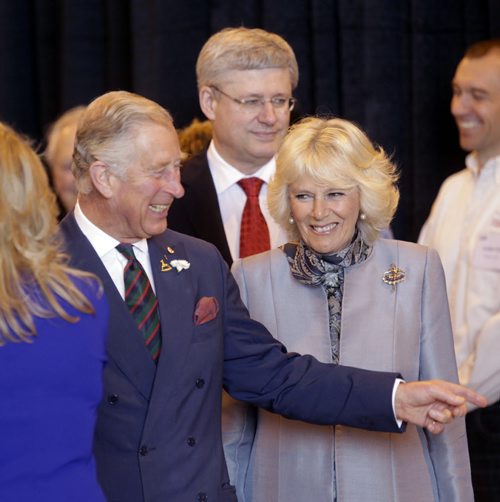 Prince Charles with his wife, Camilla, Duchess of Cornwall and Prime Minister Stephen Harper visit with guests at the Stevenson Hangar Wednesday morning.  Wayne Glowacki / Winnipeg Free Press May 21 2014