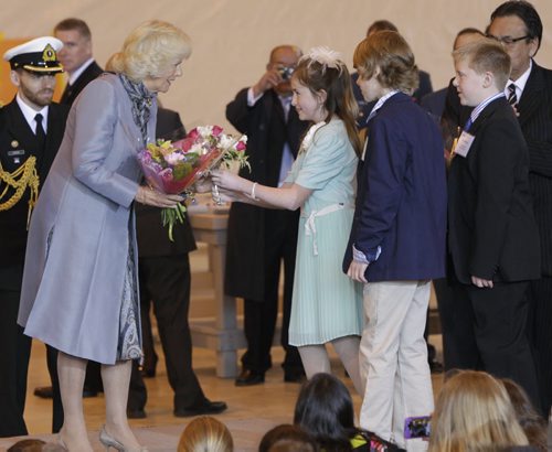 Camilla, Duchess of Cornwall receives flowers from Avery Good, Ethan Enns and Ryan Petricig, three grade six scientists from Brant Argyle School in Argyle Mb. at the ceremony in the Stevenson Hangar Wednesday morning.  Their  science experiment was sent to the international Space Station to study how to protect astronauts from cancer caused by radiation.     Wayne Glowacki / Winnipeg Free Press May 21 2014