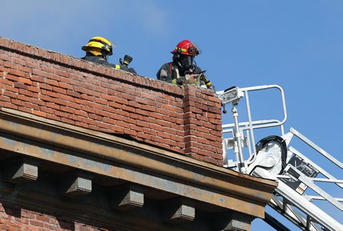 Firefighters work at the scene of a blaze on Wed., May 21, 2014, in the Rubin apartment block at Morley Avenue and Osborne Street. Photo by Jason Halstead/Winnipeg Free Press