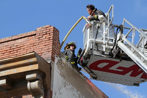 Firefighters work at the scene of a blaze on Wed., May 21, 2014, in the Rubin apartment block at Morley Avenue and Osborne Street. Photo by Jason Halstead/Winnipeg Free Press