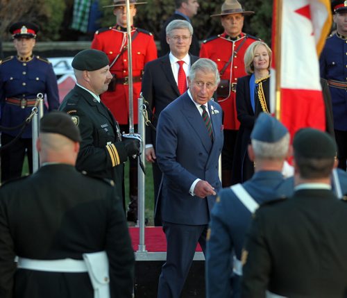 Prince Charles makes his way through tinspect the honor guard after a walkabout at the Legislature. May 21, 2014 - (Phil Hossack / Winnipeg Free Press)