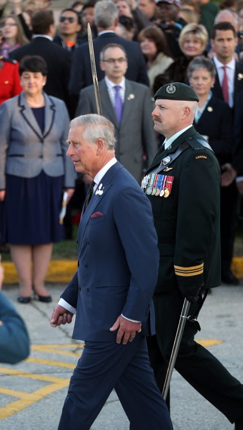 Prince Charles inspects the honor guard and received full military honors before departing Winnipeg Wednesday evening. May 21, 2014 - (Phil Hossack / Winnipeg Free Press)