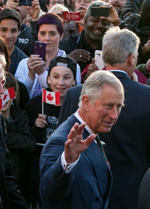 Prince Charles waves to the crowd at the Legislature Wednesday evening. More than 1000 people cheered for Prince Charles and Camilla, Duchess of Cornwall, as they made their final stop at the Legislature on a whirlwind 27-hour royal tour visit to Winnipeg. 140521 - Wednesday, May 21, 2014 - (Melissa Tait / Winnipeg Free Press)